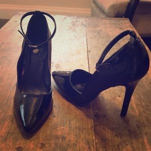 Shiny black high heels with ankle strap